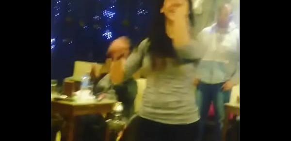  arab girl dancing with friends in Cafe